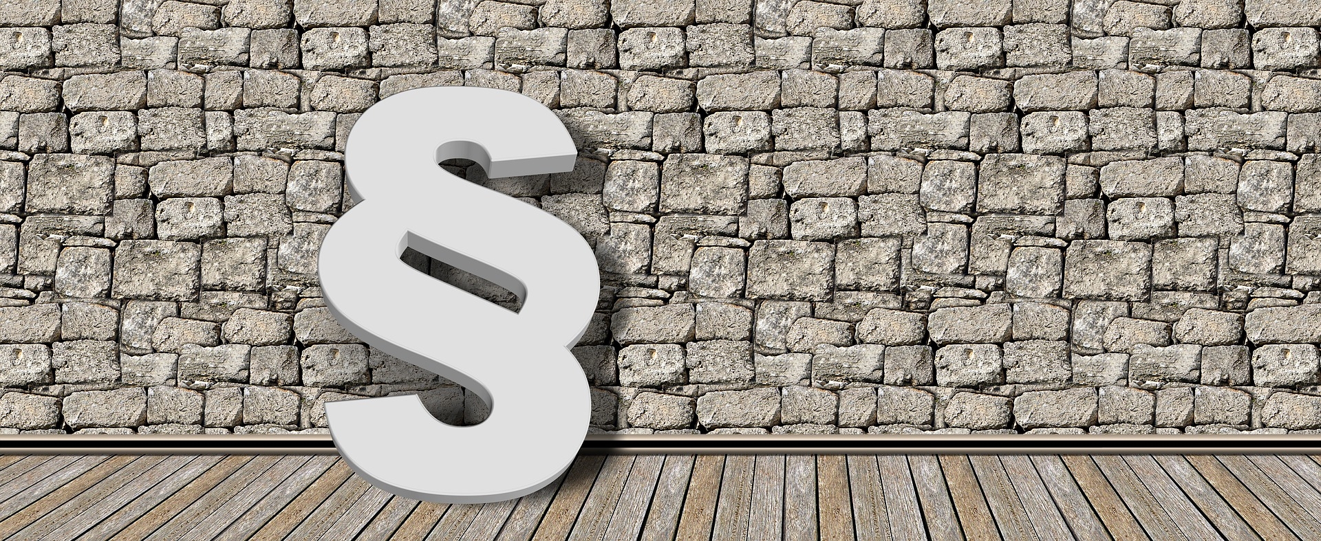 Steinmauer im Hintergrund und ein weißes Paragraphenpiktogramm im Vordergrund