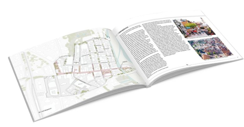 Es ist ein aufgeschlagenes Buch zu sehen, das einen ersten Eindruck über die Gestaltung des Gestaltungshandbuches vermitteln soll. 