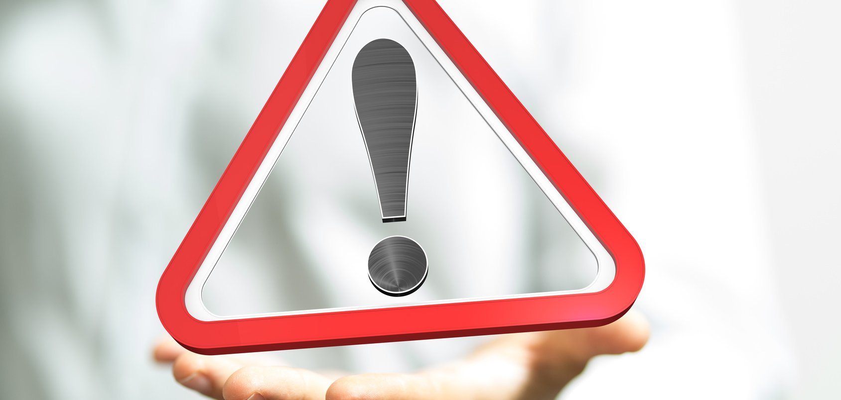 zu sehen ist ein dreieckiges Warnschild mit einem Ausrufezeichen in der Mitte