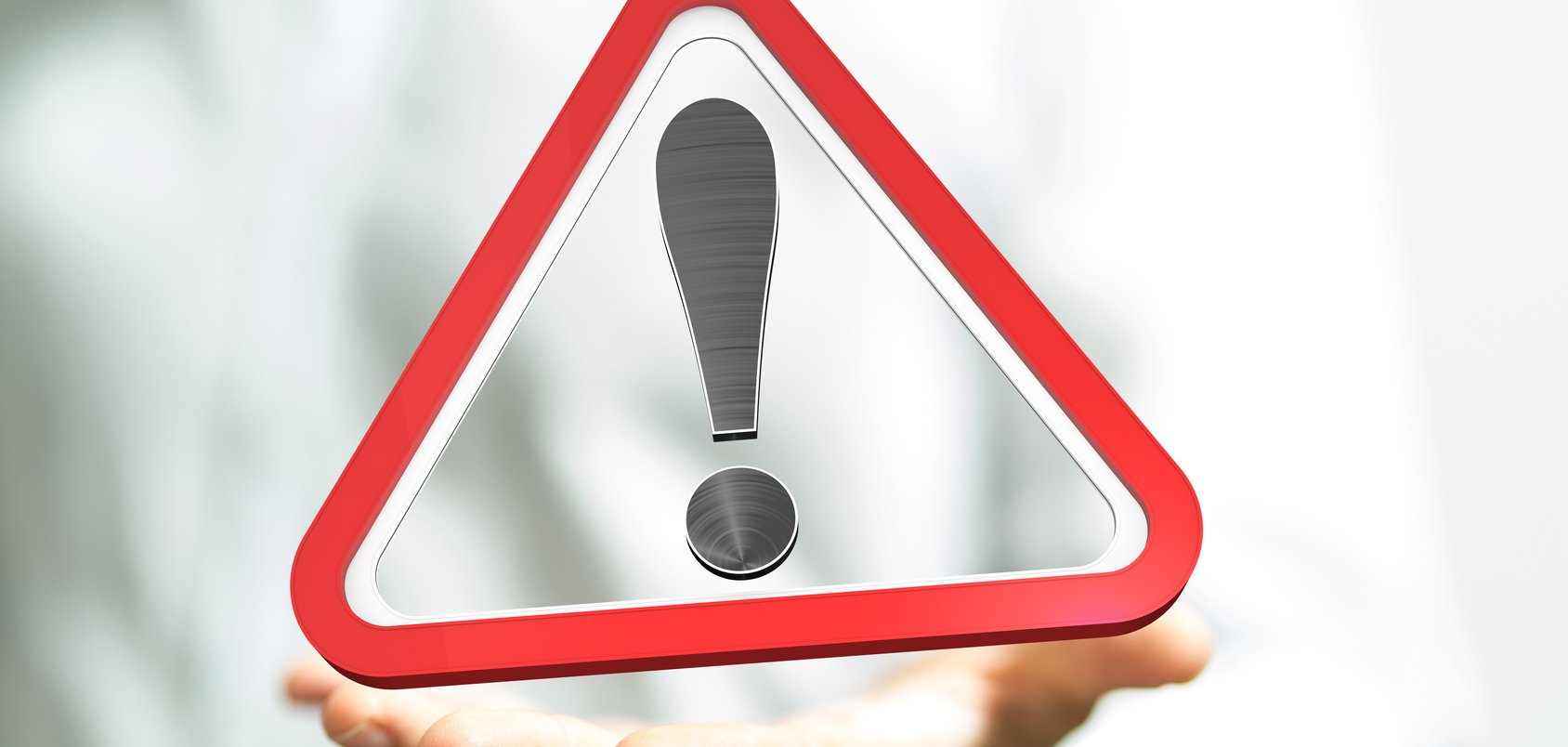 Symbolbild Warnung zu sehen ist ein dreieckiges Warnschild mit einem Ausrufezeichen in der Mitte
