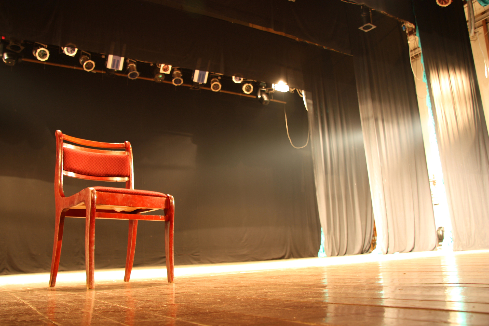 Chair on empty theatre stage Chair on empty theatre stage