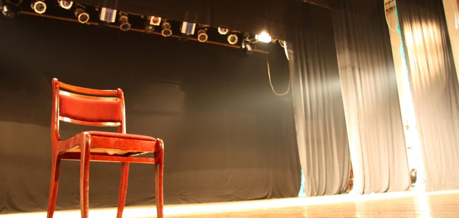 Chair on empty theatre stage