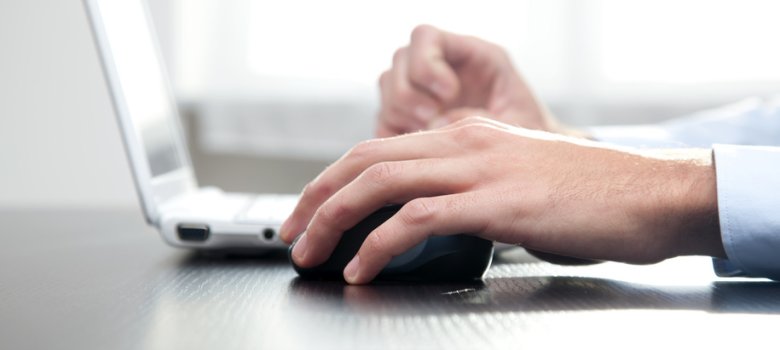 Male hand working on the laptop